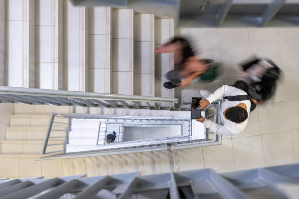 istock Students in motion on the stairs. 1453990497
