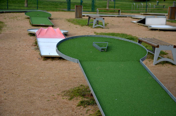 istock minigolf course in park catch golf balls behind obstacle. 1453991901