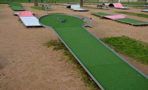 istock minigolf course in park catch golf balls behind obstacle. 1453992598