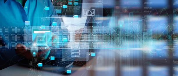 istock ERP, document management concept.Businessman working with smart phone and laptop computer with icons on virtual screen and office blur background. 1453992970