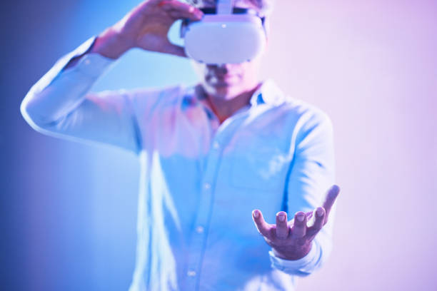 istock Metaverse headset, virtual reality and man hand holding cyber world ai, digital transformation and abstract space in palms. Vr, futuristic technology and innovation software on neon studio background 1453993470