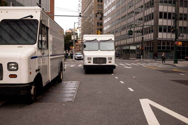 istock Post Service trucks in New York City 1453994664