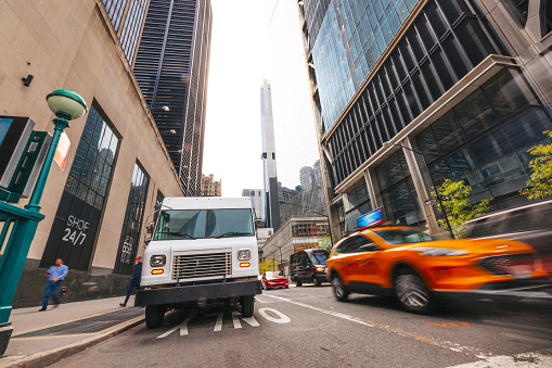 Post Service trucks in New York City lower Manhattan district.