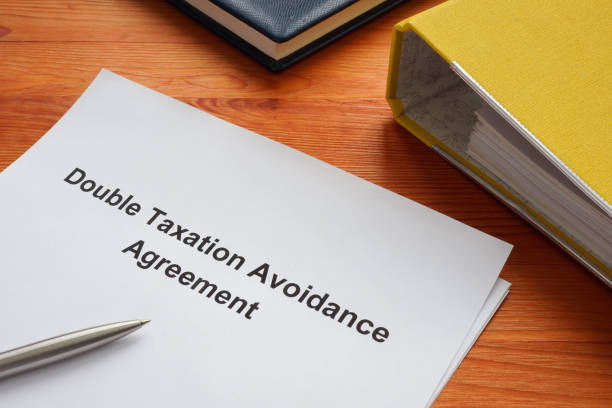 istock Double taxation avoidance agreement on the table. 1453997317