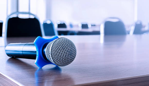 Close up microphone on table in seminar room. Close up microphone on table in seminar room. interview seminar microphone inside of stock pictures, royalty-free photos & images