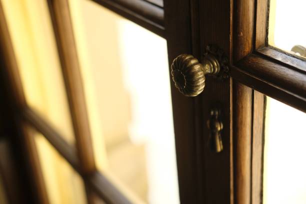 istock Antique door knob and frame in sunset 1453999353