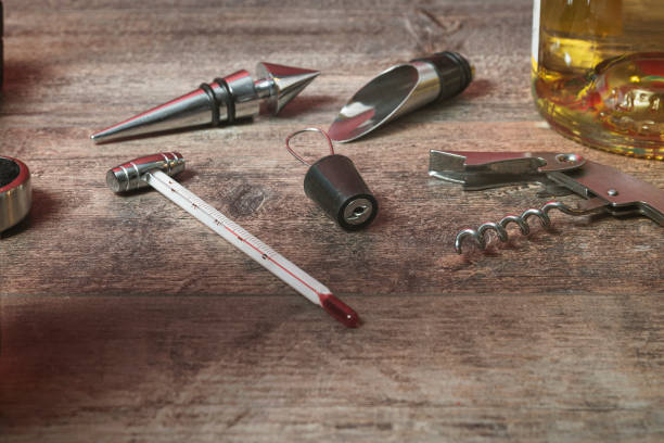 istock A set of accessories for bottled wine. Additional stoppers, means for opening, a corkscrew, a thermometer. On the texture table. Close-up. Place for text 1454004428