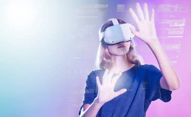 istock Virtual reality, metaverse and information with a woman user accessing a digital world with headset goggles. Future, data and ai with a female using technology to access a cyber network or dashboard 1454004778
