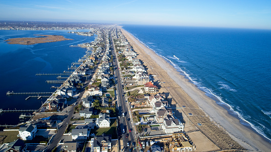 Affluent New Jersey Shore resort town, aerial view of Atlantic Ocean, beach and Barnegat Bay.