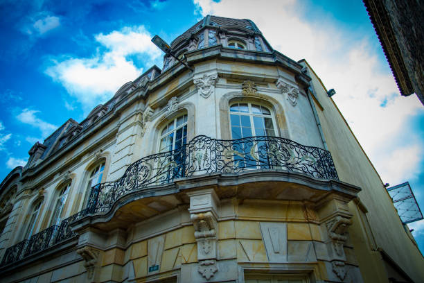 A low angle shot of a beautiful old building under the blue cloudy sky