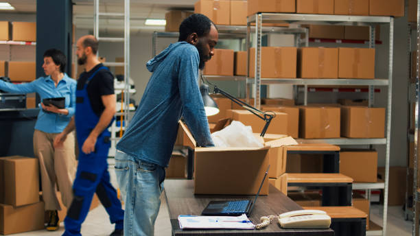 istock African american owner taking products from storage racks 1454008562