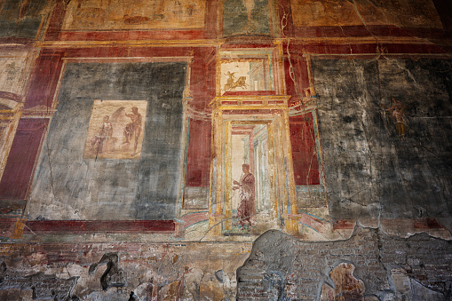 Ruins of Pompeii, Italy. Decoration detail. Fresco painting on the wall.