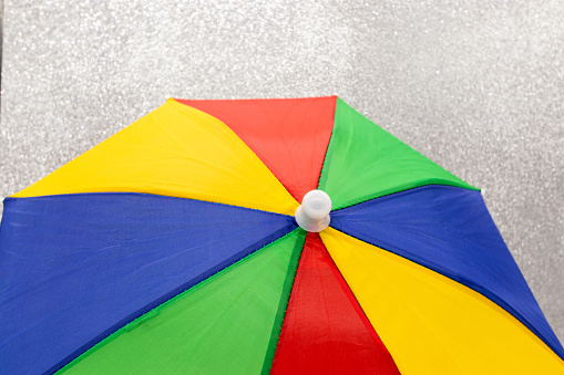 colorful umbrellas on blue sky background
