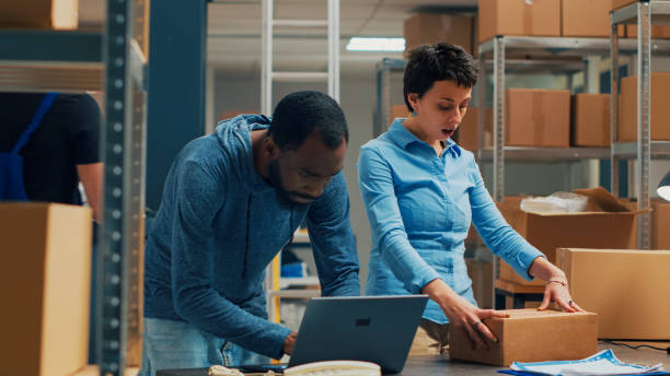 istock Owners team shipping merchandise from storehouse stock 1454009147