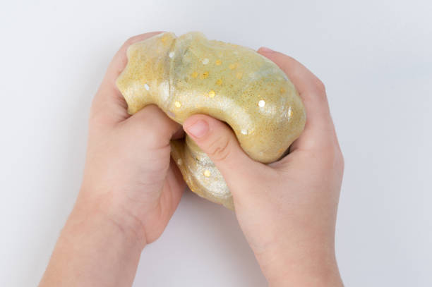 istock Child playwith colorful slime 1454009350