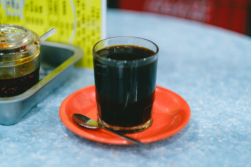 A close up of a black coffee in a cha chaan teng