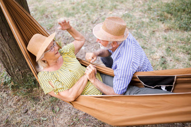 istock Senior couple enjoying in camping at forest 1454011927