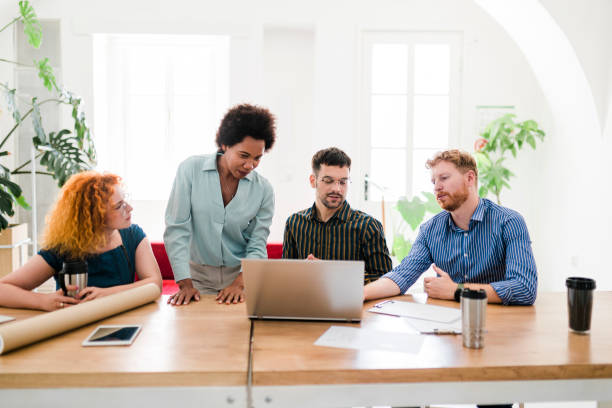istock Successful group of businesspeople having a briefing 1454013286
