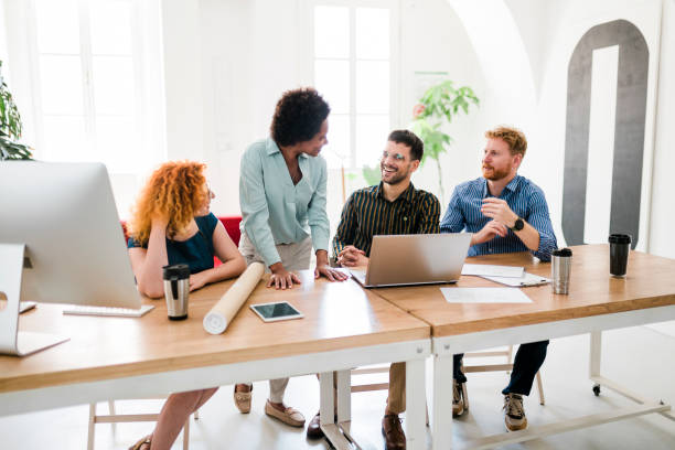 istock Successful group of businesspeople having a briefing 1454013312