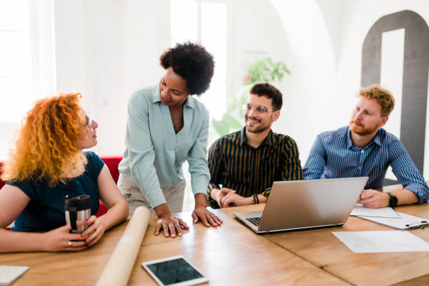 istock Successful group of businesspeople having a briefing 1454013328