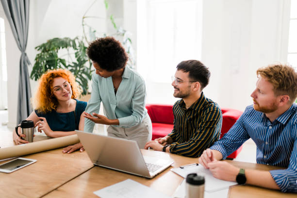 istock Successful group of businesspeople having a briefing 1454013375