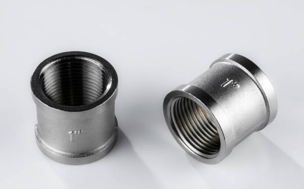 istock Two regular couplings of white metal with internal thread 1454014761