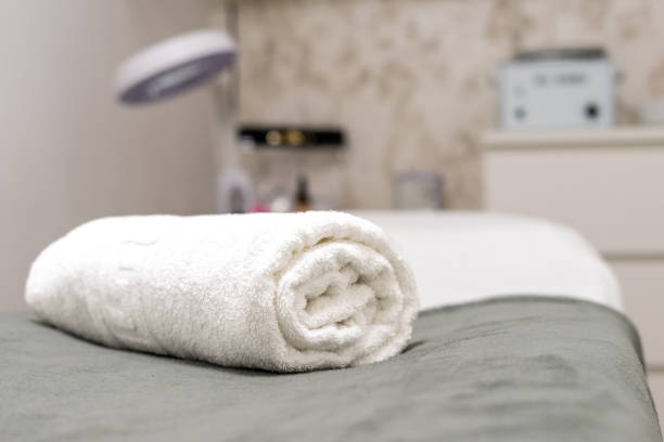 Rolled towel on the stretcher of a beauty and massage center. stock photo