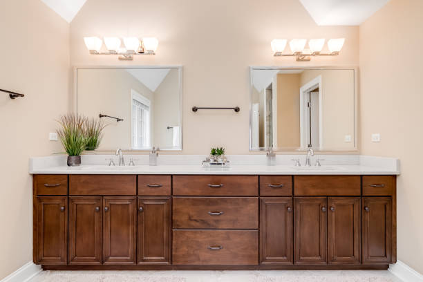 A bathroom with a large wood vanity.