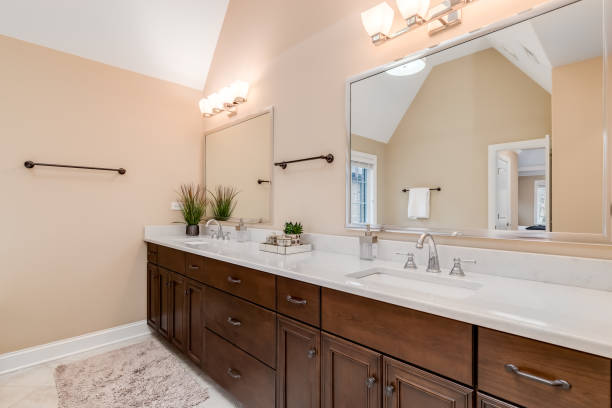 istock A bathroom with a large wood vanity. 1454018523