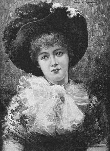istock Sweetheart, young lady with short curly hair and huge hat looking optimistic to the viewer, dreamy facial expression 1454019411