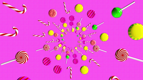 Different sized handmade candies on pink background