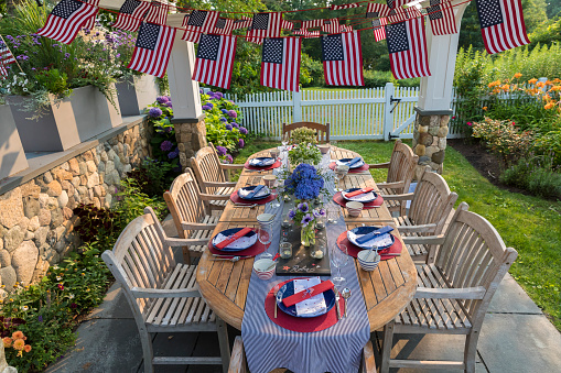 Festive Fourth of July party table set for garden party in Chatham, Massachusetts, United States