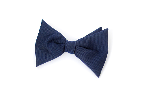 Closeup of a blue bow tie on a white background.