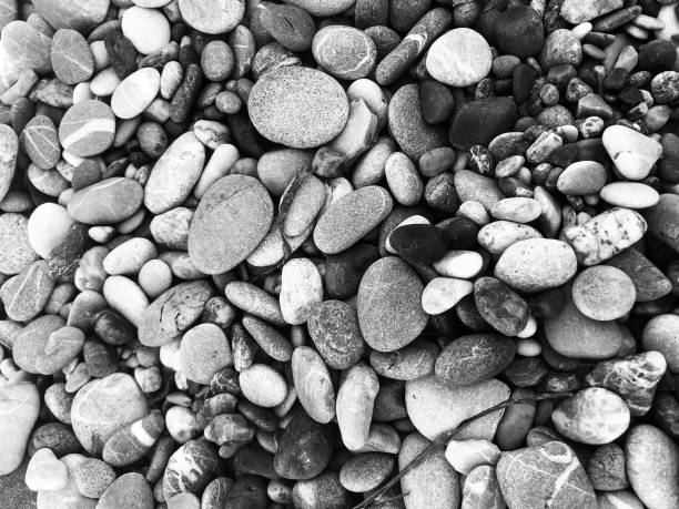 Pebble background stone nature rock abstract pattern design material gravel beach sea surface grey close up wallpaper background decoration fashion beach sea art rough summer detail spa granite