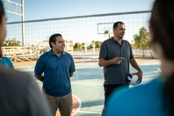 istock Coaches ( or sports judge ) talking with athletes before the game 1454026373