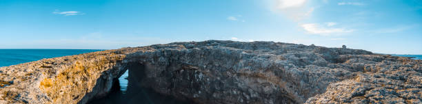 coral lagoon hole panorama. huge hole in the coral rocks at the northern coastline in malta island, europe.