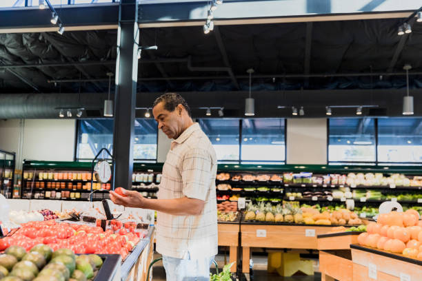 istock Mid adult man shopping 1454027342