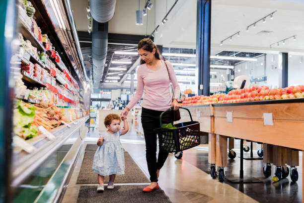 istock Toddler walks in the grocery store 1454027354