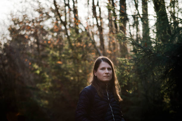 Woman with the forest on background in January