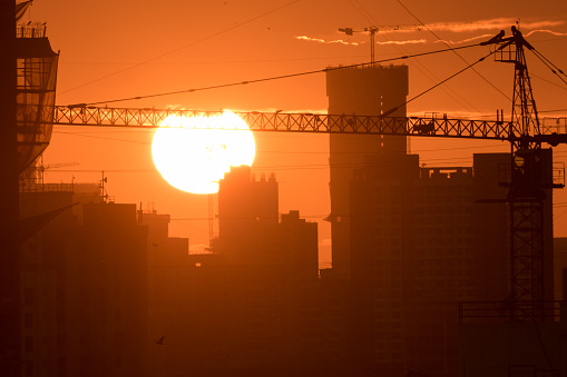 Mumbai, India - September 2022: Dramatic sunset with a skyline of suburban Mumbai.