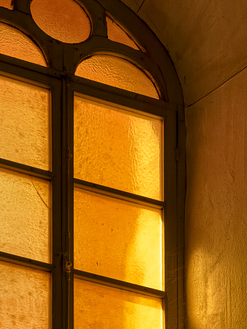 Window features of a church along the streets of San Quirico d'Orcia in Tuscany Italy