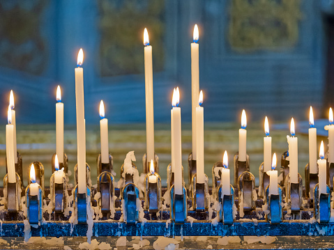 Candles lit in a church found in the town of Montepulciano in Tuscany Italy