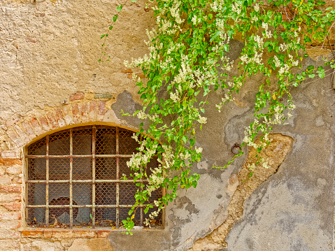 Window features of apartments along the streets of Monticchiello in Tuscany Italy