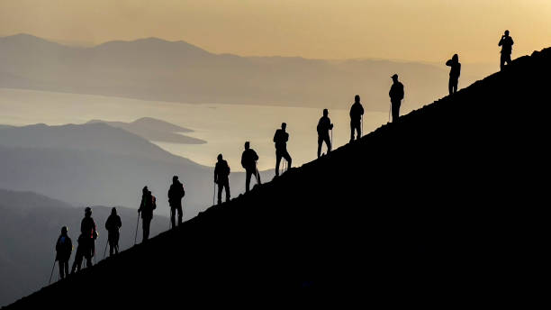Views of the crowded mountaineering team at the summit stock photo