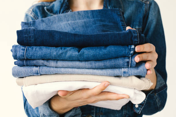 istock Woman Holding Jeans 1454038237