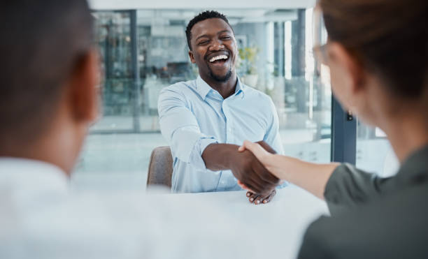 istock Handshake, interview and business people for diversity partnership, contract deal or b2b welcome meeting, Collaboration, agreement and recruitment black man shaking hands for career or job onboarding 1454038355