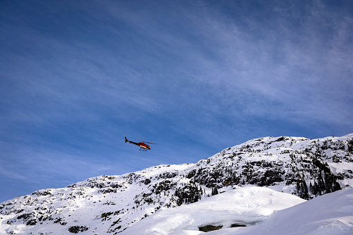 Helicopter in the Coast Mountains of British Columbia. Scenic helicopter flight.