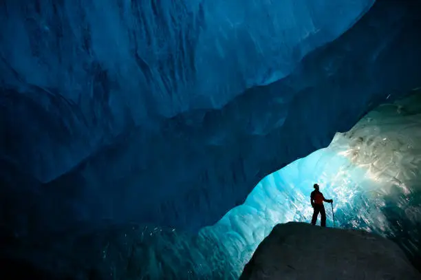 Photo of Man inside a glacial ice cave