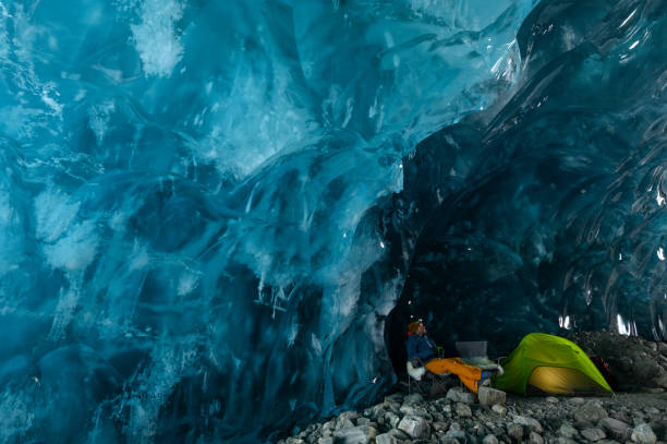 istock Camping in a glacial ice cave 1454039341