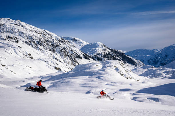 istock Snowmobiling fresh powder in the mountains 1454039380
